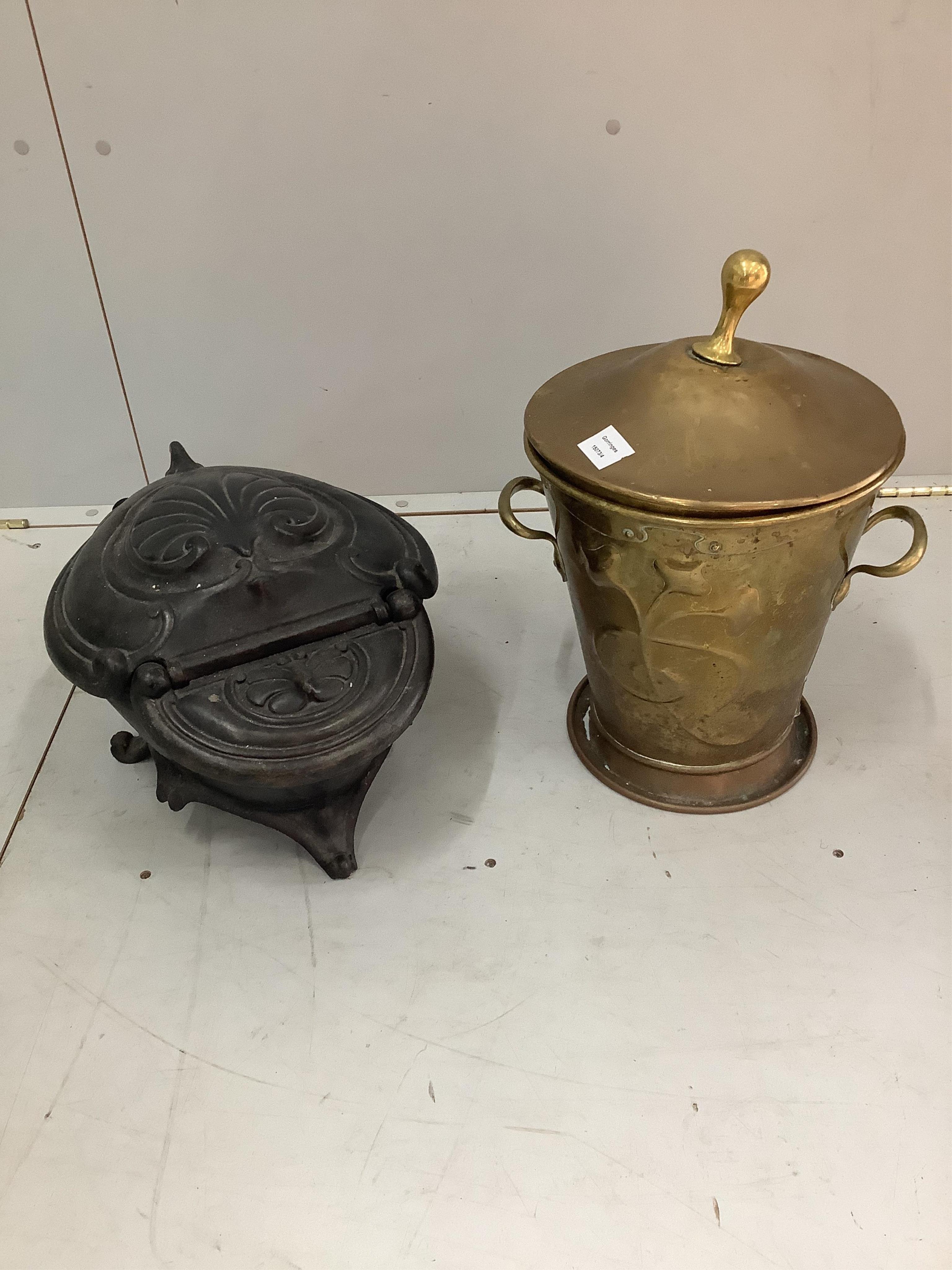 A Victorian cast iron coal scuttle, width 34cm, height 29cm, together with an Art Nouveau style embossed brass coal bin. Condition - fair